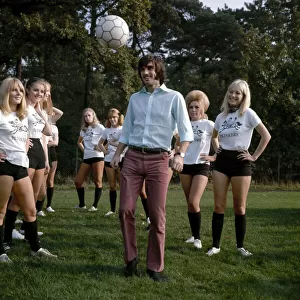Manchester United footballer George Best shows girls of Blinkers United how to control a