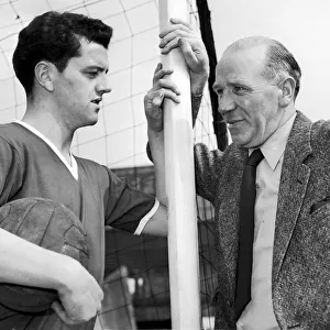 Manchester United footballer Tommy Taylor with his manager Matt Busby, circa 1957