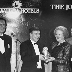 Margaret Thatcher presents the award to Mr Bernard Robinson, with Paul Nicholson, left