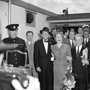 Marlene Dietrich arriving in London for Cabaret actress surrounded by men