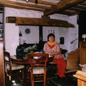 Mavis Nicholson TV Presenter sitting in her Dining Room Area