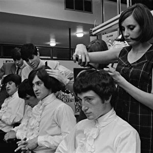 Members of the British pop group The Kinks having their hair styled at a salon