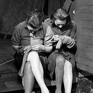 Mending their stocking at training and reception Depot for ATS girls in Aldermaston