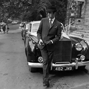 Mens Fashion: Leaning Against the Rolls Royce is Tony Newton in a two-piece suit in silk