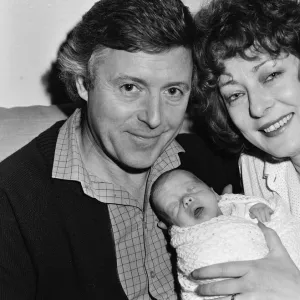 Michael Aspel and his wife Lizzie Power with their newborn son, Patrick