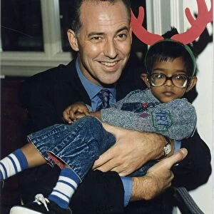 MICHAEL BARRYMORE, COMEDIAN, HOLDING A LITTLE BOY 15 / 12 / 1993