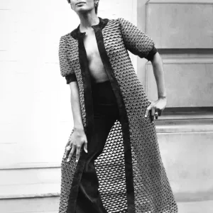 Fashion 1960s Print: A woman models a long coat and matching suede pants Fashion 1960s Print: A woman models a long coat and matching suede pants