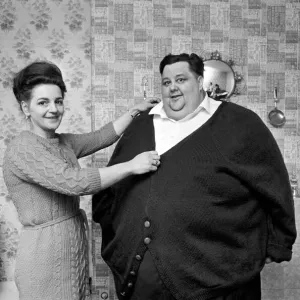 Print of a woman knitting a cardigan for the world's fattest man Print of a woman knitting a cardigan for the world's fattest man