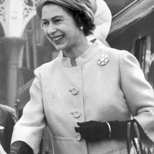 The Queen steps smiling from the Royal Train at Victoria Station Print 1972 The Queen steps smiling from the Royal Train at Victoria Station Print 1972