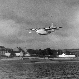 A Sunderland Flying Boat Print over Neyland Village A Sunderland Flying Boat Print over Neyland Village