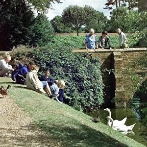 The moated manor house Baddesley Clinton, Warwickshire. Visitors with swans