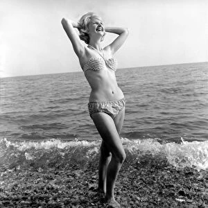Model Angela Williamson on the beach. June 1960 M4326