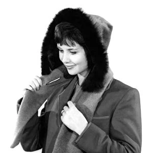 Model Ann Cave wearing a winter jacket with fur lined hood
