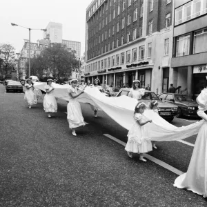 Model Michelle Hardy and a squad of bridesmaids show off her wedding dress