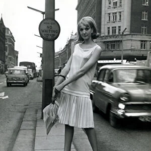 A model wearing Mary Quant Good Girl fashions for spring 1964 in London