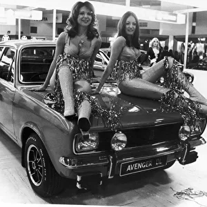 Two models pose on the bonnet of the Chrysler Avenger DL at the 1972 Motor Show at Earls