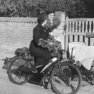 A mother stops district nurse Lily Rands on her bicycle to seek advice for her little