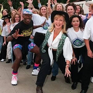 Mr Motivator TV Presenter with Sally Meen GMTV Presenter wearing hat during an outside