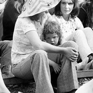Music fan with young child at The Isle of Wight Festival. 30th August 1970