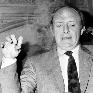 Neil Kinnock ex-MP and Leader of the Labour Party smoking a pipe at the House of Commons