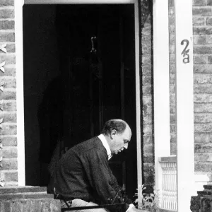 Neil Kinnock MP Former Labour Party Leader outside his house taking in his delivered milk