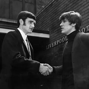 New signing Larry Lloyd is greeted by Emlyn Hughes upon his arrival at Anfield