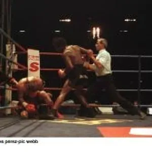 Nigel Benn finishes Danny Perez during their fight at Wembley