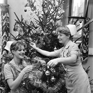 Nurses decorate a Christmas tree in Dudley Guest Hospital Birmingham