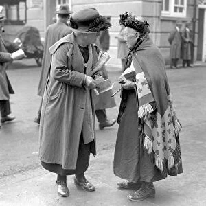 Old Kate the tipster at the Derby gives a tip to a woman punter, June 1924