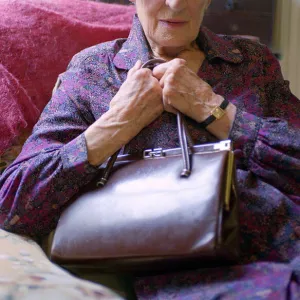 Old Lady holding her handbag Old Lady Sitting in A Chair