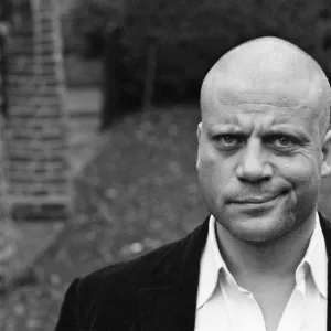 Oliver Reed not wearing his wig at his home in Wimbledon, South West, London