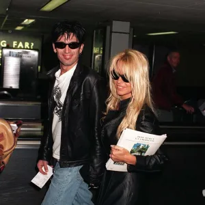 Pamela Anderson actress and husband rock star Tommy Lee arrive at Heathrow Airport after