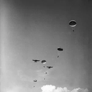 Paratroopers descending from planes during WW2. Circa 1942
