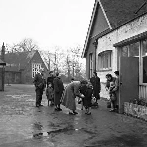 Parents collecting their children from school. 6th December 1957