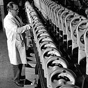 Parking Meters being checked using a stopwatch in the factory prior to dispatch all