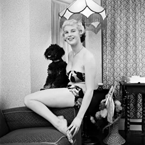 Pat Bolton seen here with her pet poodle dog. 1964 E298-014
