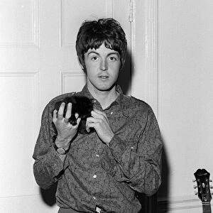 Paul McCartney holding a kittenat his home on his 25th birthday. 18 June 1967