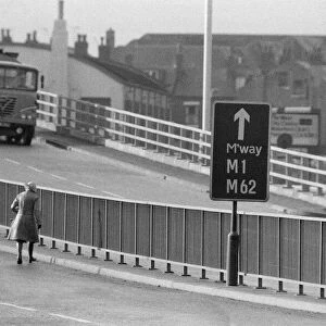 People crossing the motorway dangerously, in the north of England. 11th November 1974