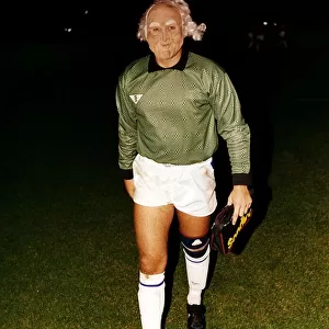 Peterborough goalkeeper Fred Barber walks off the pitch wearing a face mask after a match