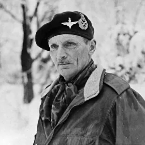 Picture shows Field Marshal Sir Bernard L Montgomery wearing his red beret with badge of
