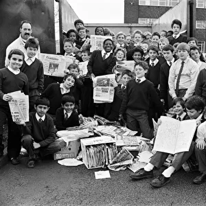 Piles of paper, these pupils from Almondbury High School have been helping to collect six