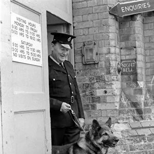 Police: Dog major with handler Gerald Ewing. March 1975 75-01234-002