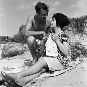 Pop singer Marty Wilde and his 19-year-old wife Joyce on the beach at Shell Bay, Dorset