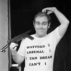 Pop star Elton John, also Chairman of Watford FC, pictured in Los Angeles giving his