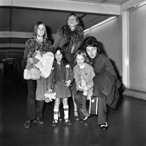 Pop star Paul McCartney and family. Carrying a portable radio