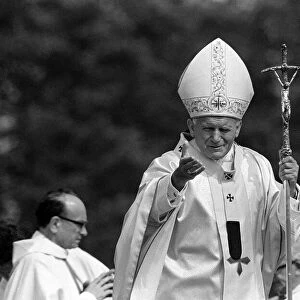 Pope John Paul II waves to the welcoming crowd at Cardiff airport LFEY003