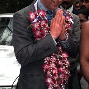 Prince Charles hands together as he arrives in Colombo in Sri Lanka in February 1998