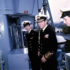 Prince Charles and Prince Philip wearing naval uniform aboard HMS Bonnington