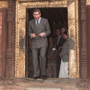 Prince Charles walking through a low temple door during his visit to Kathmandu in Nepal