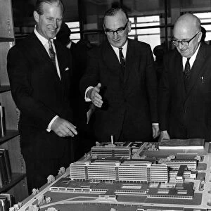Prince Philip, the Duke of Edinburgh, looking at a model of the completed scheme at